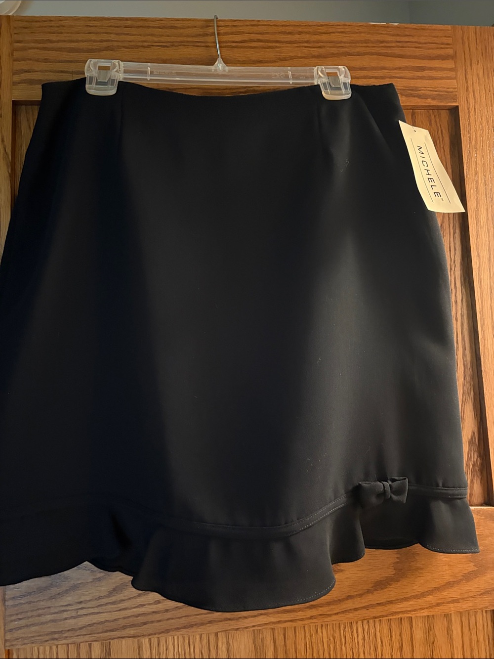 Michele Black Mini Skirt with Ruffle Hem and Bow Detail